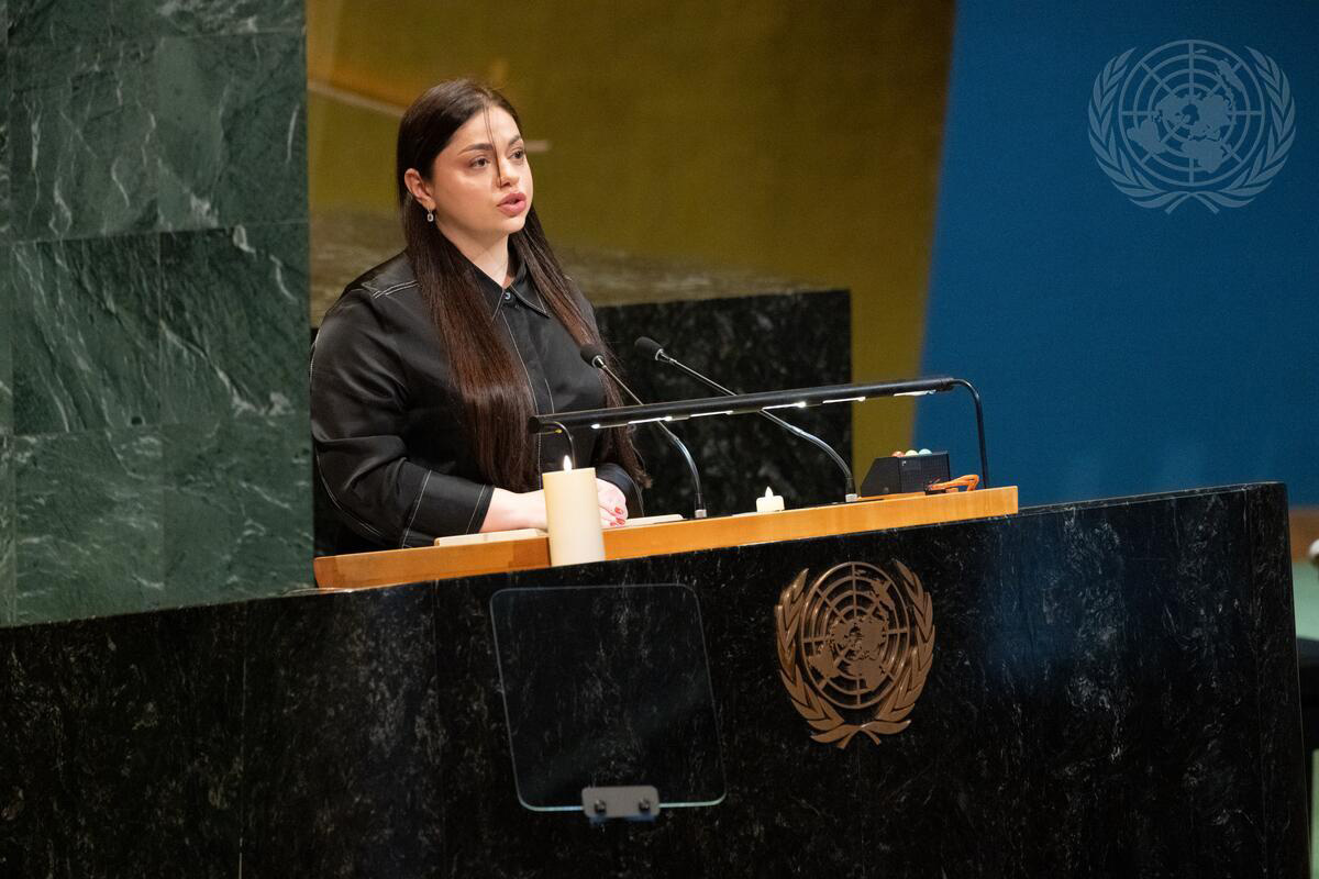 Speaker Nataliia Tomenko who read the words of her grandmother Halyna Tomenko who was too ill to travel.